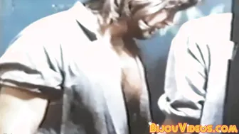 Muscular hunks enjoy retro glory hole blowjobs during work break