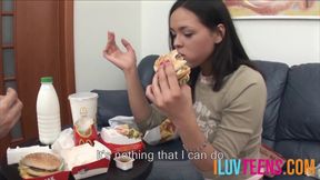 Young couple enjoying fast food before engaging in dirty mischief