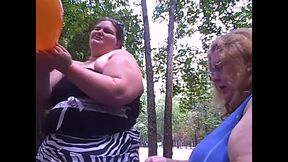 BBW outdoors enjoys a balloon blow-up and popping