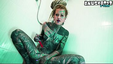 Petite tattooed goth girl wields big dildo in solo shower play