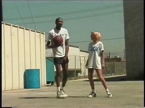 Blond whore sucks and fucks huge black cock on a rooftop