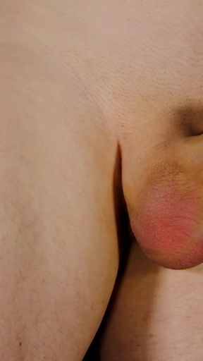 Key moment from "Man masturbating, playing with his flaccid penis and foreskin becomes erect pulls and squeezes his cock"