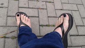 black toenail polish and black platform flip flops