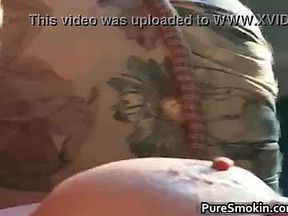 Blond MILF with huge juggs doing