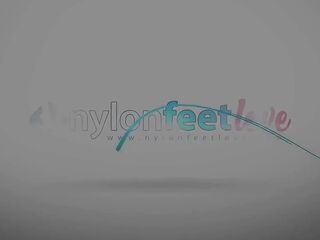 Tattooed blond smokin' and showing her feet