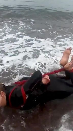 Hogtied in a Wetsuit - Rope Bondage Escape Challenge on the Beach