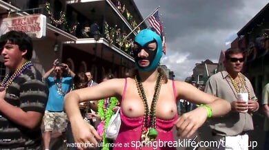 Mature blonde teases exposed during Mardi Gras street parade