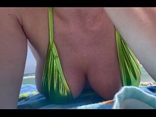 Artemisia Love at the public beach showing her ideal bazookas
