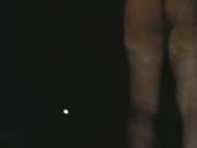 Sissy in heat fucking her ass with dildo in the streets at night