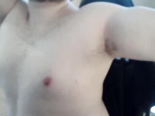 Athletic guy plays with his teats and muscles
