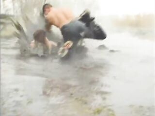 Lewd guy is fucking a sexually excited woman in the mud and enjoying it a lot