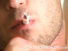 Hottie Cody lights his red cig while stroking his pinkish cock