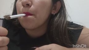 My sexy lips are painted red and I enjoy my cigarette.