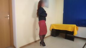 Seductive secretary in high heels and leather skirt