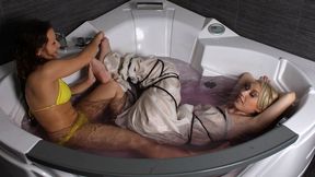 Alexa and Bianca: barefoot blonde girl, wrapped in cloth and bound with rope, is being tickled and teased by roommate in jacuzzi (HD MP4)