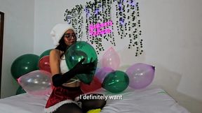 Mrs Claus sits down to pop many balloons of different sizes