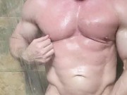 Stud shoots load and rubs cum all over his chest