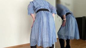 In a summery blue dress, boots and silk underwear