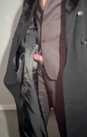 Sissy playing with cock in a ladies long coat and suit stroking myself with the lining of my coat