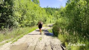 sexy blonde pissing in a puddle on the road