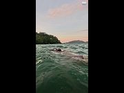 Standing Waist-Deep in the Sea at Sunset