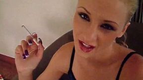 Dainty blonde prostitute takes a smoke and sucks huge plastic dildo