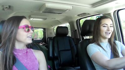 Two lesbian brunettes during a car ride lick each other to explosive orgasms