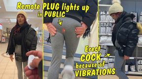 Tranny in public! Remote plug lights up while shopping! Erect cock because of strong vibrations!