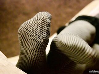 Mistress legs in opaque grey pantyhoses
