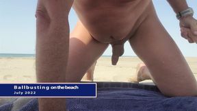 On a public beach, naked, self ballbusting exhibition