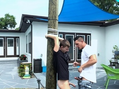 Hunk uncle finds twink tied to a pole and fucks him raw