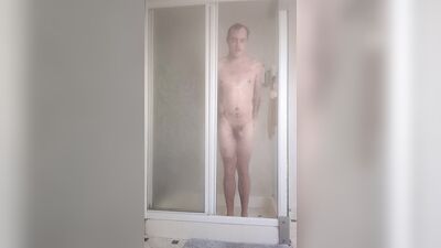 Young Lad Masturbates Bent Over in Hot Shower