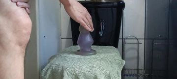 Cumming with giant plug in the ass