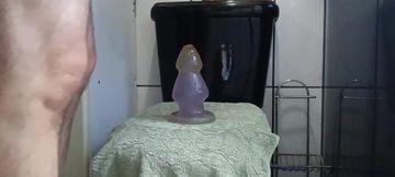 Cumming with giant plug in the ass
