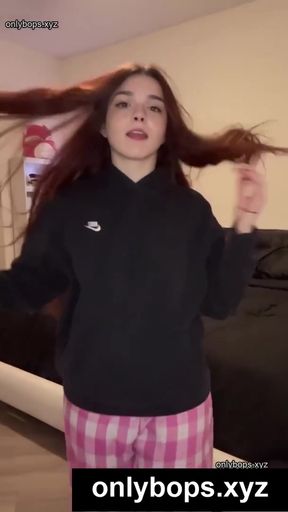 Girl with blonde hair in a black hoodie