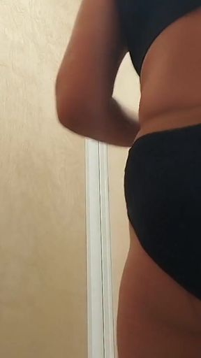 Stunning moment from "Naughty sexy milf tries on naked clothes. Hairy latina pussy tries on clothes in bed."