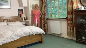 Hoovering in pink bodystocking