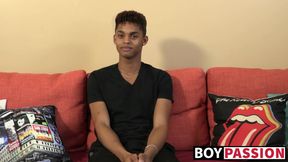 Black young man gives an interview and stimulates himself