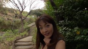 Japanese babe gives blowjob to a man in public