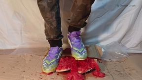 Melon and cardboard crushed in football boots