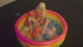 hot tatooed gril popping balloons for looners