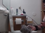 chained slave cleans toilet