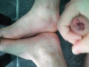 Gym fit male athlete flings spunk all over his tired feet.