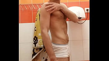 Hairy guy touching herself in the gym toilet