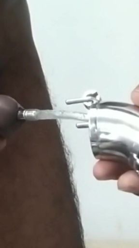 Indian pierced dick insert Catheter with Chastity Cage.   Clip 1