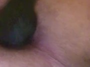playing with black knot dildo