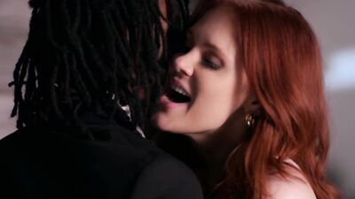 Gorgeous redhead takes a big black cock in her wet pussy