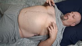 Chubby guy lays on floor and cums