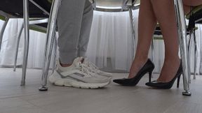 Flirting with a guy and a girl's legs under the table c