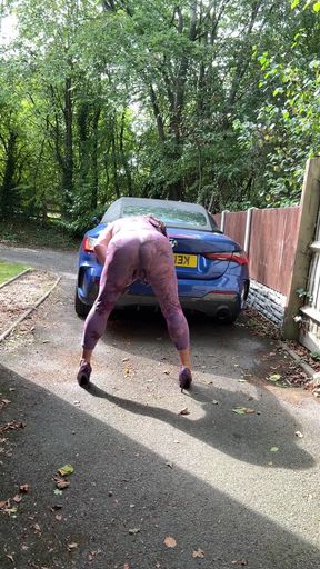 Key moment from "Sexy Crossdresser kellycd2022 in purple catsuit and heels outdoors"